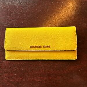 Michael Kors wallet with 4 card slots and 2 flat bill holders